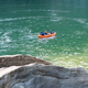 Group rafting on clear blue river